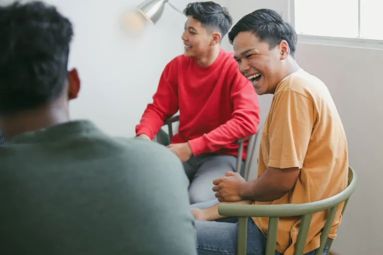 Men connecting and supporting one another in a dads support group