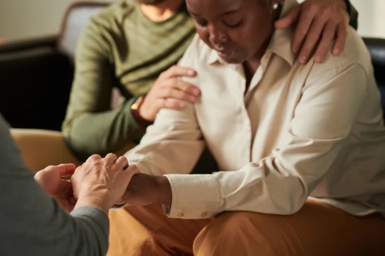 Person receiving comfort and support in a grief and loss group