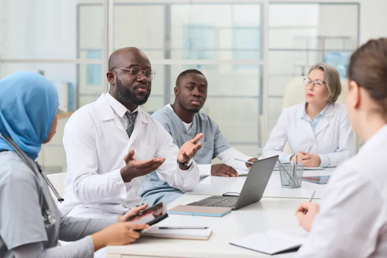 Care providers collaborating to coordinate a client's treatment plan