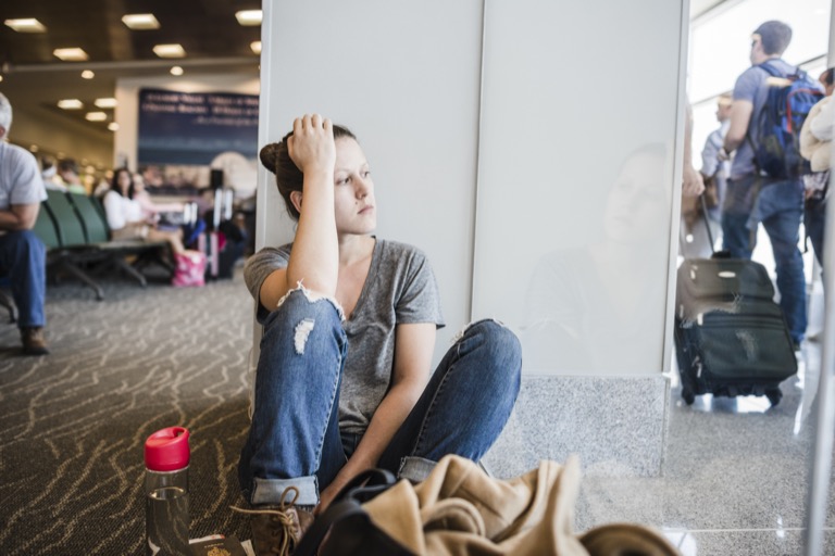 Person using a laptop in a quiet setting, representing flexible telehealth therapy access