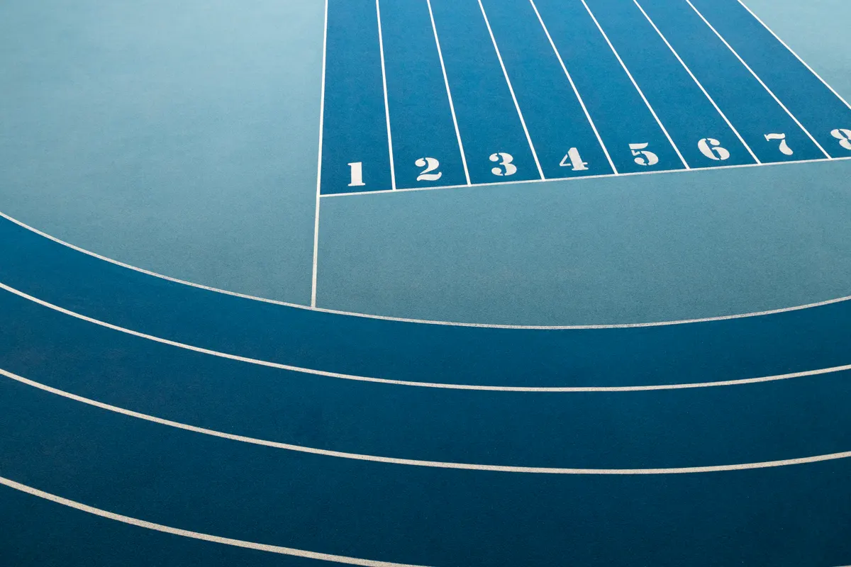 Numbered lanes of a running track from above — systems for execution
