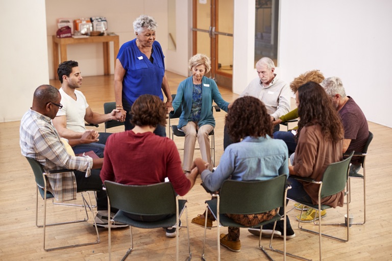 Group members showing support and unity during therapy at ZipHealthy