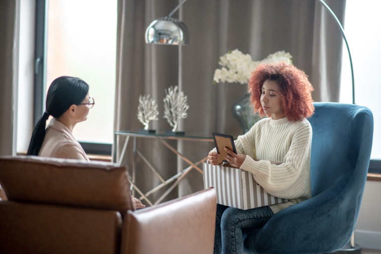 Licensed therapist in a supportive counseling session at ZipHealthy